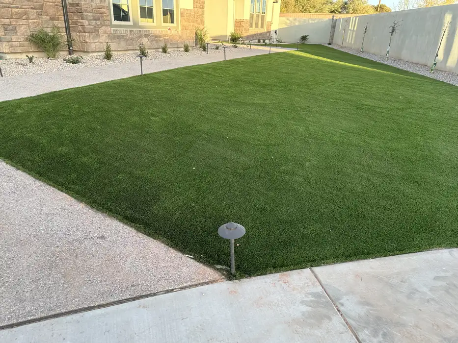 Artificial turf from Verde Valley Turf installed in residential front yard with pathway lights